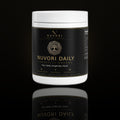 Nuvori Daily Longevity Greens jar on obsidian background